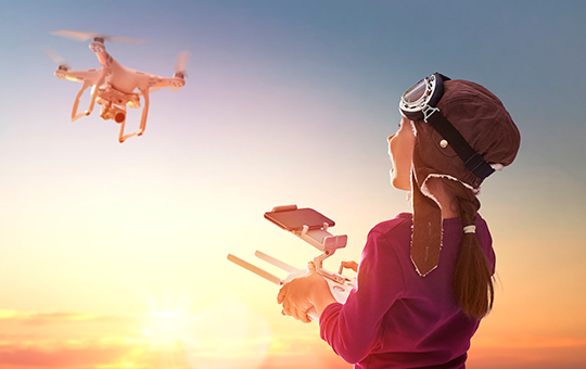 girl-operating-drone-in-the-sky